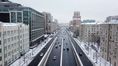 Drone slow motion along the road in snowy streets Stock Footage 169071398