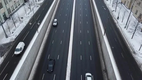 Drone slow motion along the road in snowy streets Stock-Footage 169071399