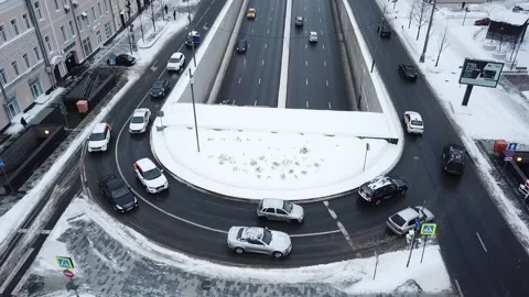 Drone slow motion along the road in snowy streets Stock-Footage 169071441