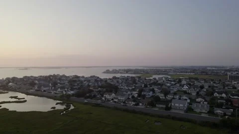 Drone slow move over Ocean City MD during sun set Stock Footage 160072614