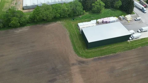 Drone - Slow Right to Left View with Tilt up -Greenhouses Property Stock Footage 314227611
