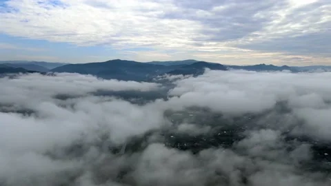 The drone is slowly descending into the clouds Stock Footage 137968713