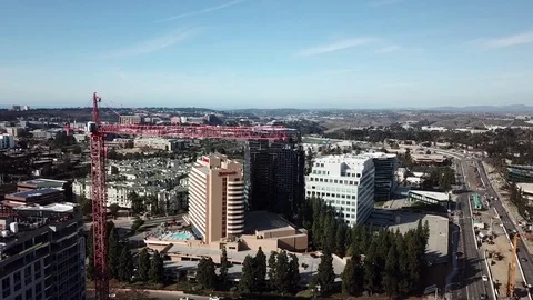 Drone slowly flies around the end of long crane boom Stock Footage 84948407