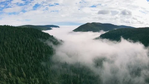 Drone slowly flies down over a beautiful mountain landscape Stock Footage 121395571