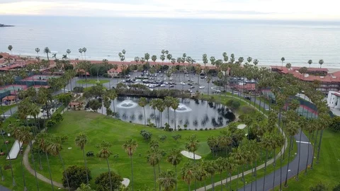 Drone slowly flies forward over a golf course in La Jolla California Stock Footage 87958812