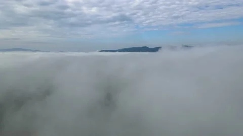 The drone slowly flies over the clouds Stock Footage 137968937