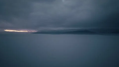 Drone slowly flying through clouds at sunrise Stock-Footage 323619427