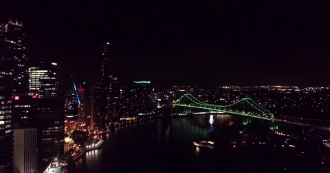 Drone slowly goes down for establishing city, bridge and river shot aerial 4k Stock Footage 99319715