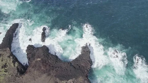 Drone slowly going up above rocky coastline and waves Alantic ocean azores Stock Footage 233470101