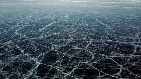 Drone Slowly Moving Forward Over The  Frozen Lake, Covered With Cracks  Stock-Footage 104845646