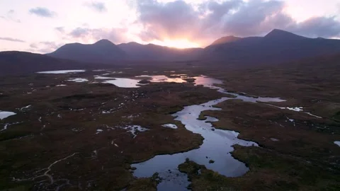A drone slowly rolls to the left high above a wetland landscape of islands Vídeos de archivo 227122076