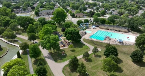 Drone slowly rotating above a park Video stock 246717961
