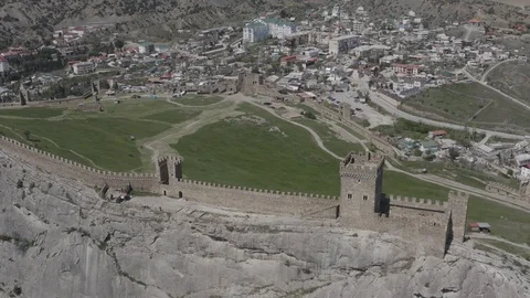 The drone smoothly descends along the wall of the Consular castle Stock Footage 124797406