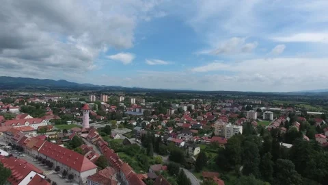 The drone smoothly moves backwards while flying over an old European city. Stock Footage 266168144