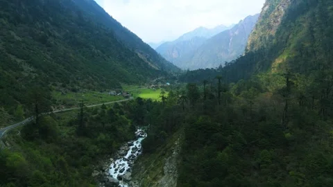 Drone soaring over a breathtaking green valley on the way to Gurudongmar Lake. Stock Footage 311389090