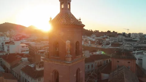 Drone soaring over malaga's historic bell tower at golden hour, showcasing .. Stock Footage 344052009