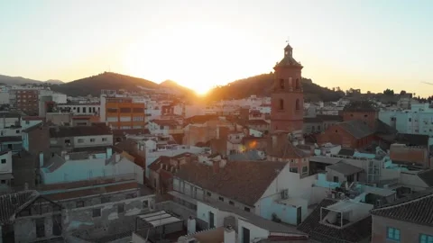 Drone soaring over Malaga's sun-kissed rooftops, revealing historic charm a.. Stock Footage 344053469