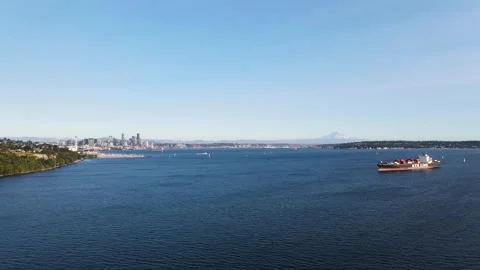 Drone soars above Seattle's coast, revealing the city skyline in the Stock Footage 248034701