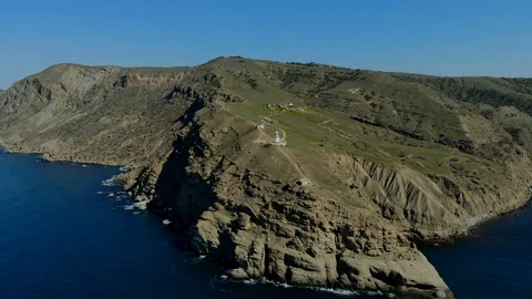 Drone spin shot of lighthouse on background of sea. Beautiful white lighthouse Stock-Footage 123222725