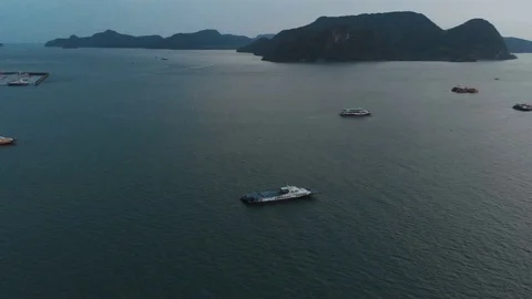 The drone is spinning around its axis. Panorama of the quay of the city of Kuah Stock Footage 106810486