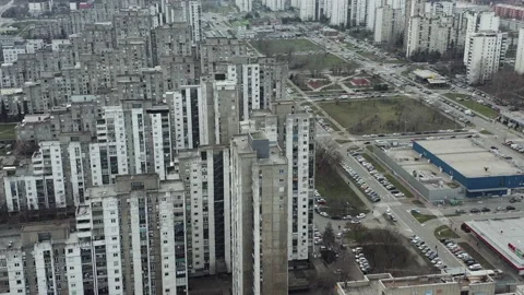 Drone Spins Around a Cluster of Brutalist Residential Blocks Video stock 148474610