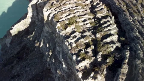 Drone Spiral Around Man on Volcanic Crater with Turquoise Lake Stock Footage 315224366
