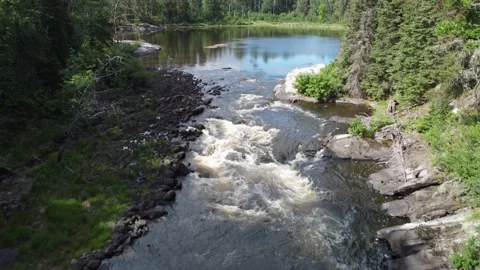 Drone Springtime Summer rushing water on lake Stock Footage 199309937