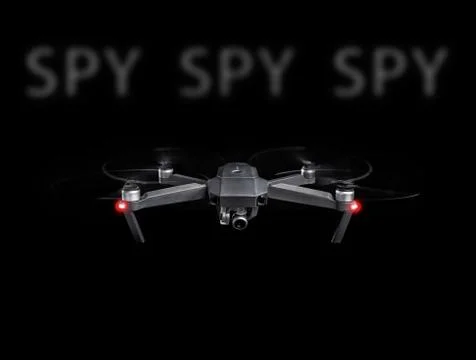 Drone spy. Drone - Flying in the dark, on black background. Closeup on dark.  Stock Photos