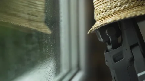 Drone stands in the window because it is raining. Stock Footage 146417654