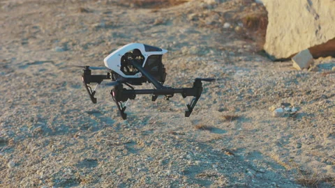 Drone starting fly on rock mountains. Modern technologies for shooting photos Stock-Footage 175403065