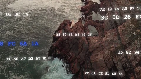 Drone starting scan, rock showing white-blue codes, waves crashing, camera Stock Footage 334242314