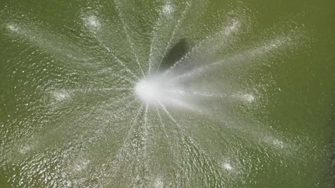 Drone static shot over water fountain 4K Stock Footage 314617676