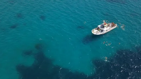 Drone static view of boat party from  top side view on Mallorca Stock Footage
