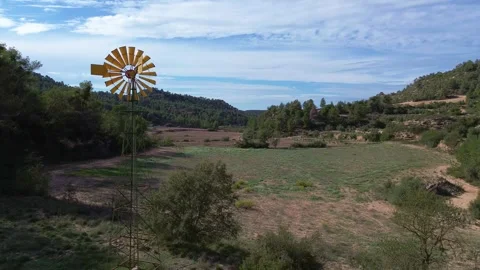 Drone Still Shot of Yellow WIndmill Stock Footage 286248661