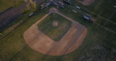Drone straight down ascending over baseball diamond Stock Footage 127053725