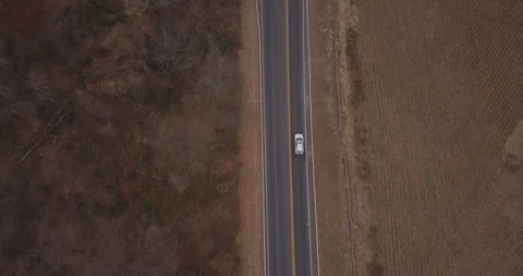 Drone straight down over road and cars cornfield Stock Footage 98842944