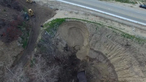 Drone straight down view of giant sinkhole crater Stock Footage 92037526