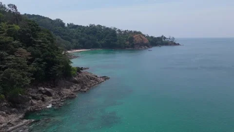 Drone Straight Flyover Rocky Cliff to Banana Beach Phuket Reveal Vídeos de archivo 332115835
