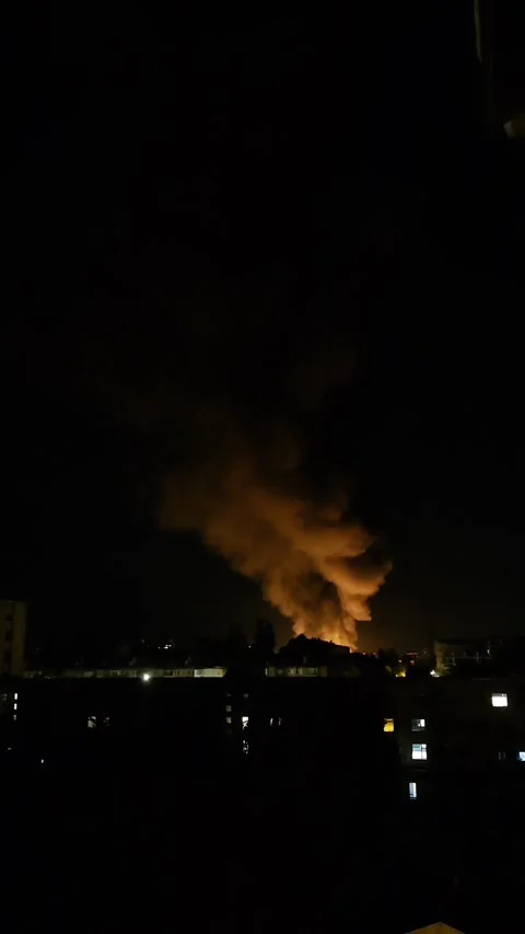 Drone strike with fire smoke explosion and diving drone sound in night city Stock Footage 331012636