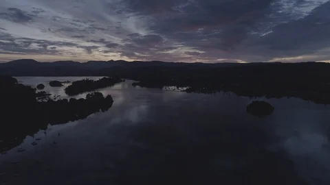 Drone Sunrise over Windermere, reflections of clouds - DLog - Lake District Video stock 90896679