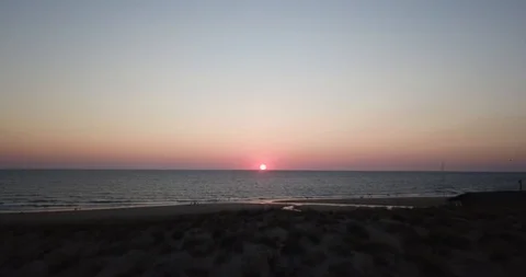 Drone sunset beach sun orange Stock Footage 122870585