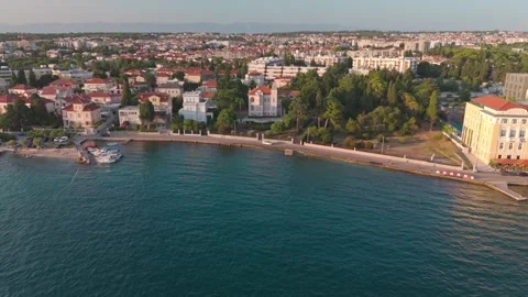 Drone Sunset Flight Along Zadar Coast from Hyatt Regency to Old Town Harbour Vídeo Stock 341659522