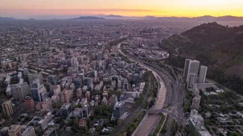 Drone sunset flight over Mapocho River and Santiago skyline Stock Footage 310960569