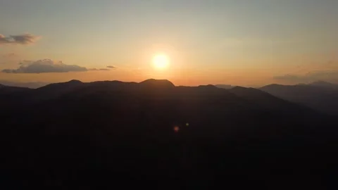 Drone sunset over mountain range. Aerial drone view of sunset Stock Footage 321135894