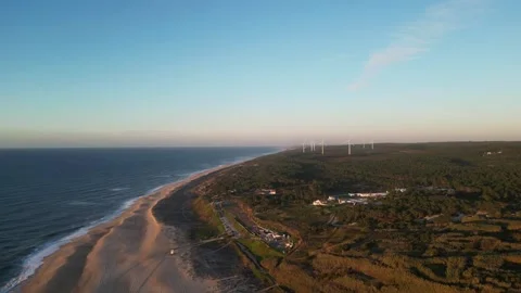 Drone sunset over Nazaré Lighthouse and Atlantic waves in Portugal. Stock Footage 329118617