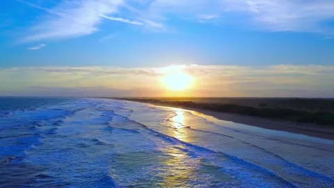 Drone Sunset over Ocean Waves and Sandy Beach – Golden Hour Aerial View Stock Footage 315761681