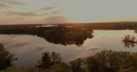 Drone at Sunset over still River Water Vídeo Stock 82073475