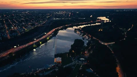 Drone Sunset Over Urban River Bridge in Philadelphia Schuylkill Boathouse Row Stock Footage 281676214