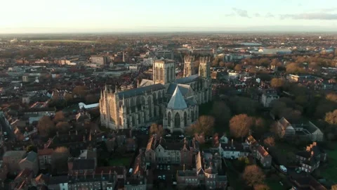 Drone sunset pull back revealing huge cathedral York Minster in historic Stock-Footage 168070216