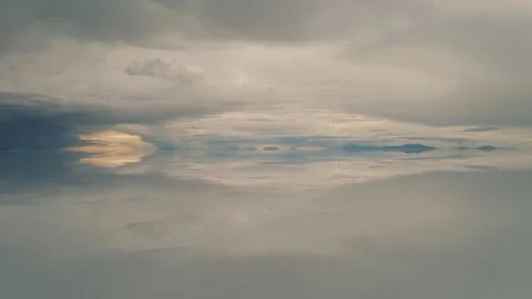 Drone sunset of Salar De Uyuni reflection water salt lake, desert in Bolivia 4K Stock Footage 198317565